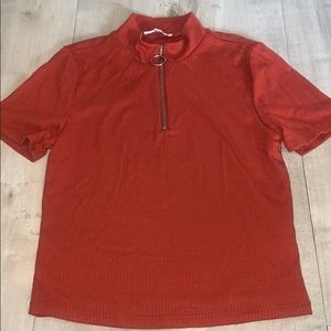 Dark orangey colored top